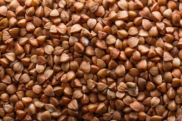Grain buckwheat on a dark stone background