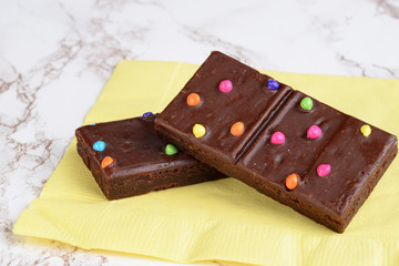 chocolate fudge brownies on yellow napkin