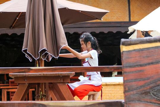 Asian Students ,Children working in the restaurant during the summer