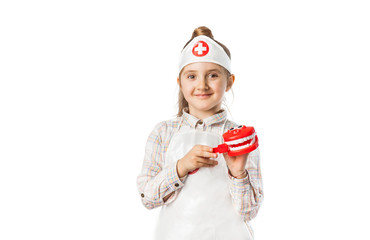 Happy smiling baby girl with dentist tool
