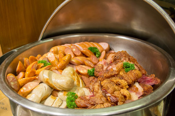  delicious mixed sausage in dish background