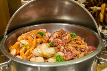  delicious mixed sausage in dish background