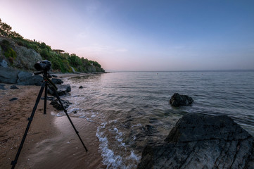 Paralia Gerakinis, Sithonia, Chalkidiki, Greece - June 29, 2014: The camera Nikon D7100 is on a tripod Vanguard Alta PRO and a large tele-lens Sigma 18-250 mm