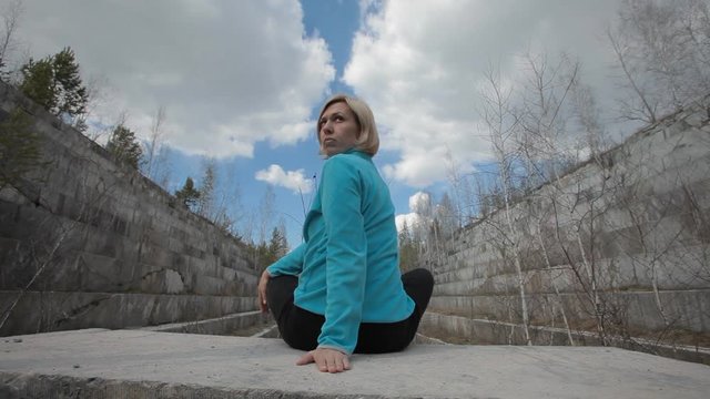 woman doing yoga on marble
