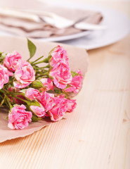 Rose bouquet on table setting