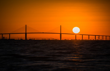 Fototapeta na wymiar Dramatic colorful sunrise of the skyway Bridge on West Coast of Florida