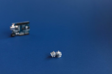 Diodes on blue background and Arduino uno Board for programming education development platform. Technology. Electronic computing machine. Concept