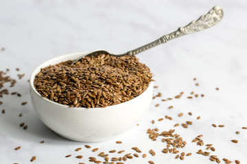 Bowl of flax seeds with spoon