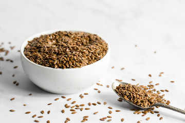 Bowl of flax seeds with spoon