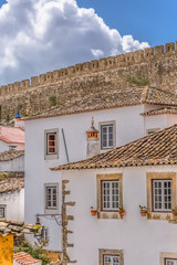 View of the fortress and Luso Roman castle of Óbidos, with buildings of Portuguese vernacular architecture and s