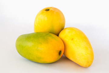 Ripe mango on a white background