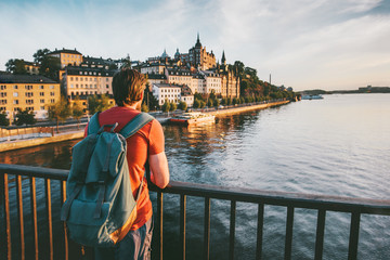 Tourist man sightseeing Stockholm city enjoying view traveling lifestyle summer vacations in Sweden