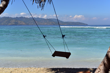 Swing on tropical beach in indonesia Gili Trawangan.