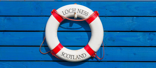 Lifebelt with Loch Ness Scotland Lettering on wooden Background Caledonian Canal in Fort Augustus...