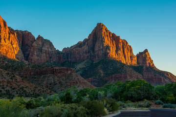 Red Sunset in Zion National Park green and orange colours with blue sky