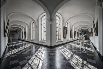 Hallways of abbey with shadow of friars