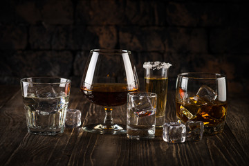 Fototapeta Strong alcohol drinks - whiskey, cognac, vodka, rum, tequila.  obraz