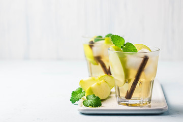 Apple cinnamon kombucha iced cocktail.  Selective focus, space for text.
