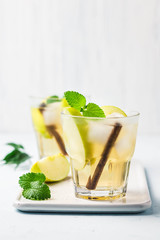 Apple cinnamon kombucha iced cocktail.  Selective focus, space for text.