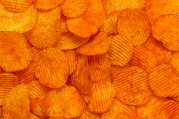 Background corrugated golden chips with texture 