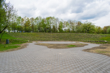 tracks in spring park landscape against blue sky