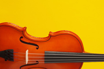 Classical music concert poster with orange color violin on yellow background with copy space for your text
