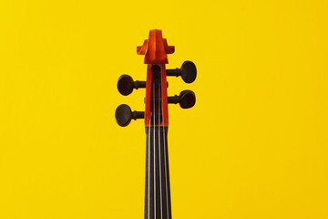 Classical music concert poster with orange color violin on yellow background with copy space for your text