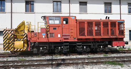 side view of a  snow plow locomotive