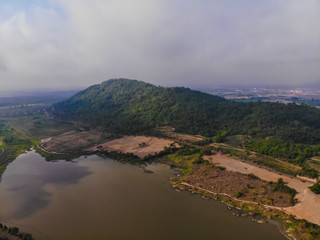 Obraz premium Top view of plantation, mountain lake, misty sky in Thailand.