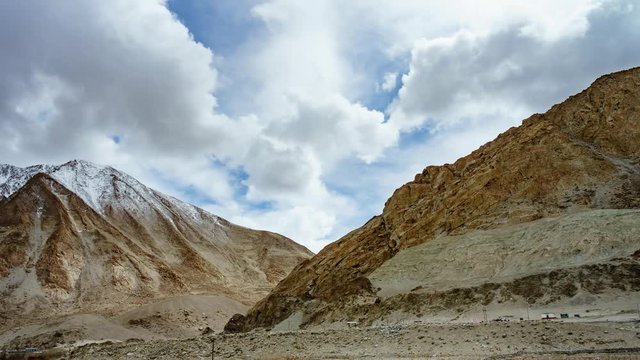 4K Timelapse of high mountain range landscape with beautiful sky and amaizing cloud moving as background of near Pangong Lake, Leh, Ladakh, Jammu and Kashmir, India