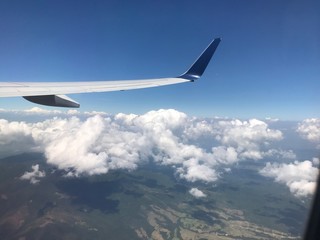 Fototapeta na wymiar Flying over the clouds