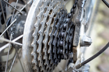 Dirty rear cassette with stars in oil and dust on a bicycle