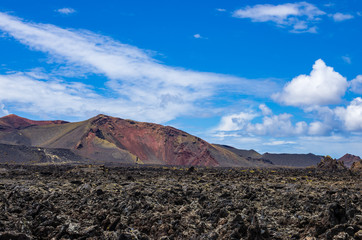 Fototapeta na wymiar Landscape of volcanoes and solidified lava in Timanfaya national park