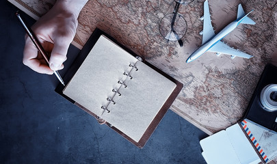 Travel concept. Map on the table andl aircraft.