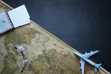 Travel concept. Map on the table andl aircraft.