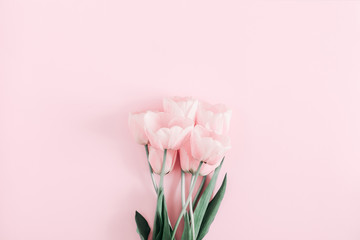 Beautiful composition spring flowers. Bouquet of pink tulips flowers on pastel pink background. Valentine's Day, Easter, Birthday, Happy Women's Day, Mother's Day. Flat lay, top view, copy space