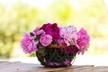 Peonies flowers in basket outdoor