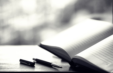 open book and a table black and white