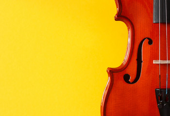 Classical music festival poster with violin on yellow background © Mikalai