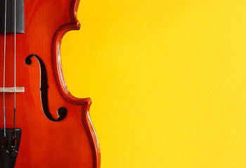 Classical music festival poster with violin on yellow background