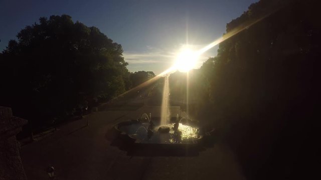 Timelapse video of a spring in front of high traffic road in Munich, Bavaria during the sunset