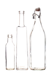 Barely there clear glass bottles, isolated on white background.