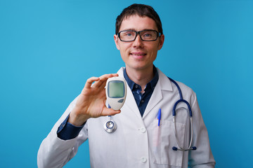 Portrait of doctor with stethoscope and blood glucose meterin his hand