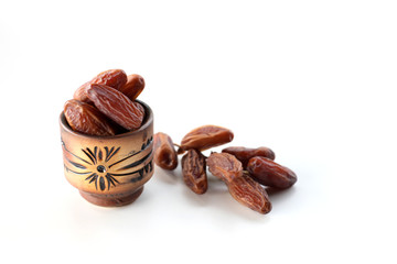 Creative layout made of dried date isolated on white background