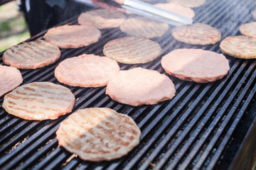 Delicious grilled beef burger on barbecue outdoor