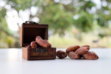 Dried date on wooden table close up