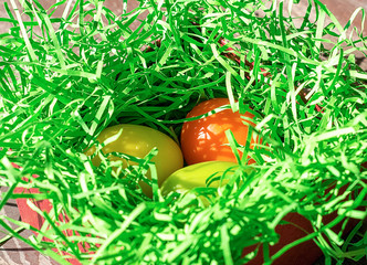 Easter colored eggs in the basket. Bright card. The concept of the Easter holiday.