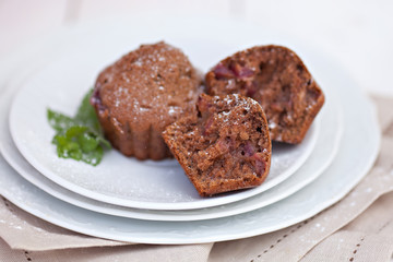 Chocolate muffins with ripe cherries