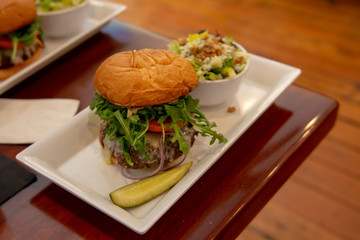 Not just another hamburger - a vegan patty with salad and garnished with vegetables