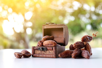 Ramadan concept with nature background, holy quran, date fruit and rosary